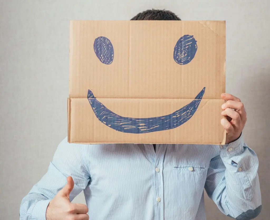 person holding a picture with a smile
